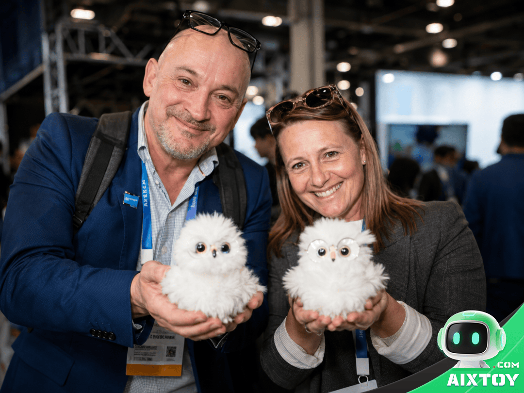 Joobie AI companion charm clipped to a bag — wearable AI pet concept