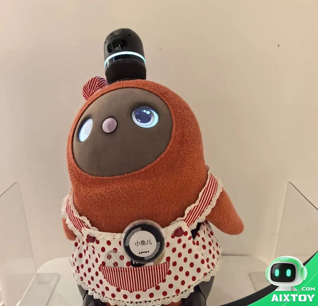 AI companion robot LOVOT being held by a person demonstrating physical affection and emotional bonding with technology