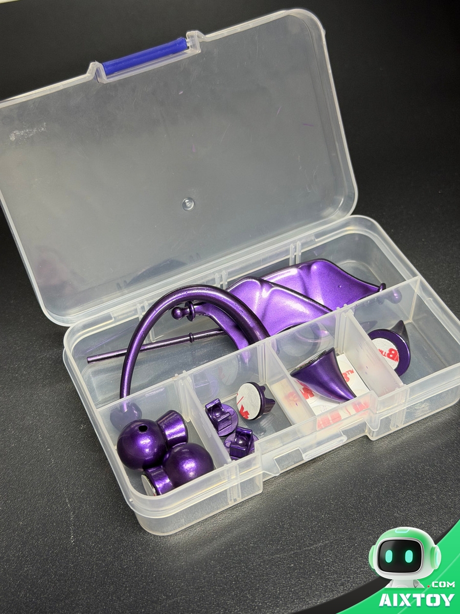 Timo accessory kit in a clear case containing purple 3D-printed horns, ears and a charging cable